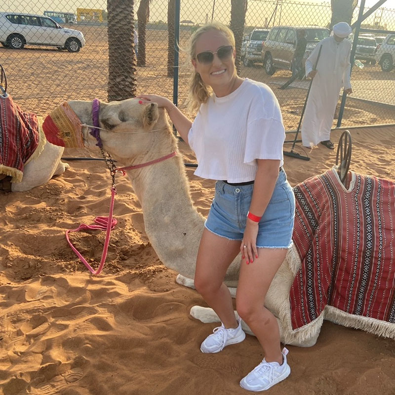 Photo of Emma Smith with a camel