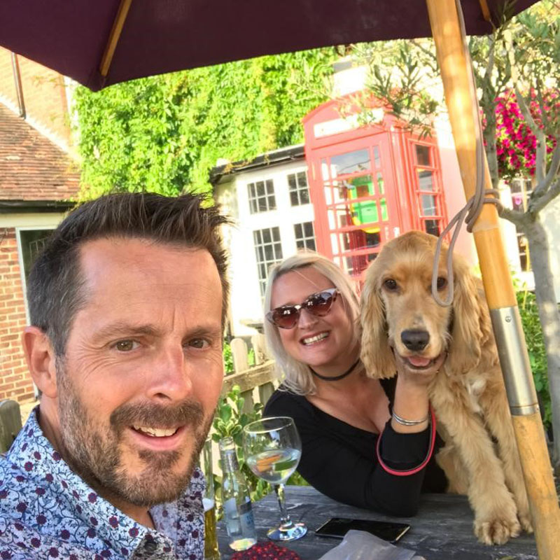 Photo of Jeremy Stuart in a beer garden with his family