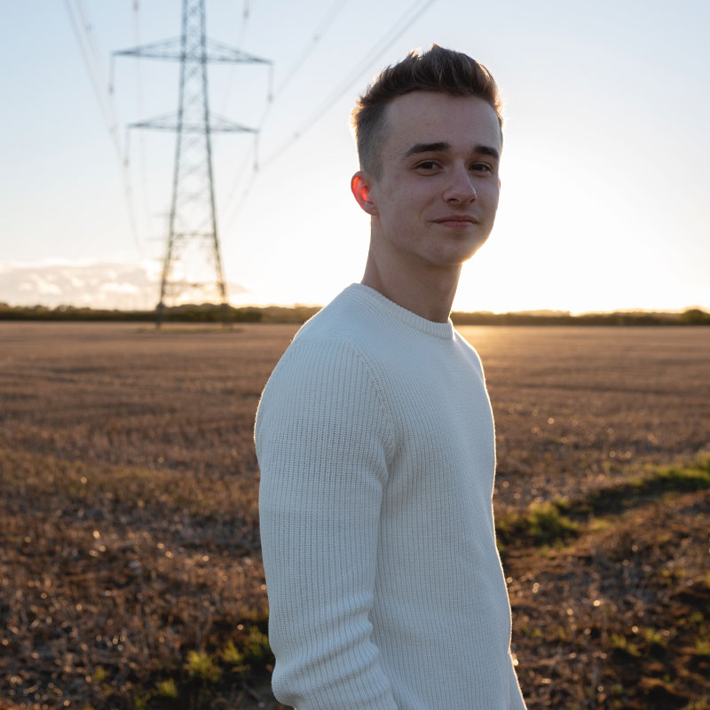 Photo of Michael James in a field