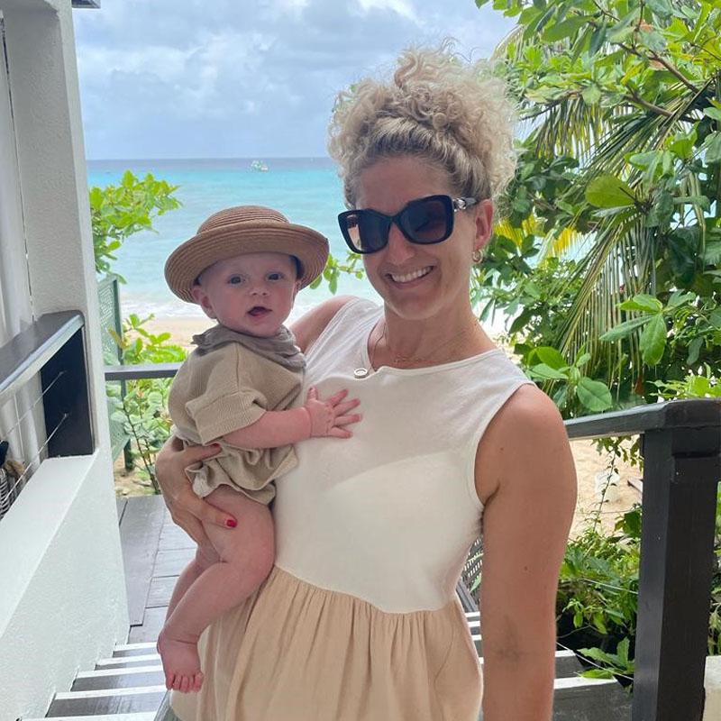 Photo of Sally Gravener holding a baby