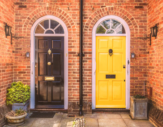 Image showing two front doors of a red brick house