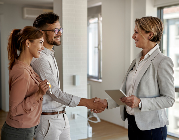 Image showing a close up of a couple shaking hand with a women